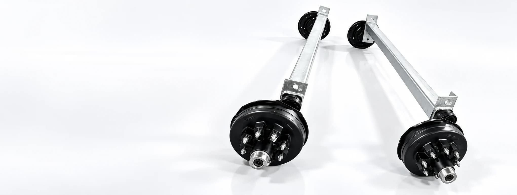 Torsion trailer axle pair for boat and yacht trailer applications